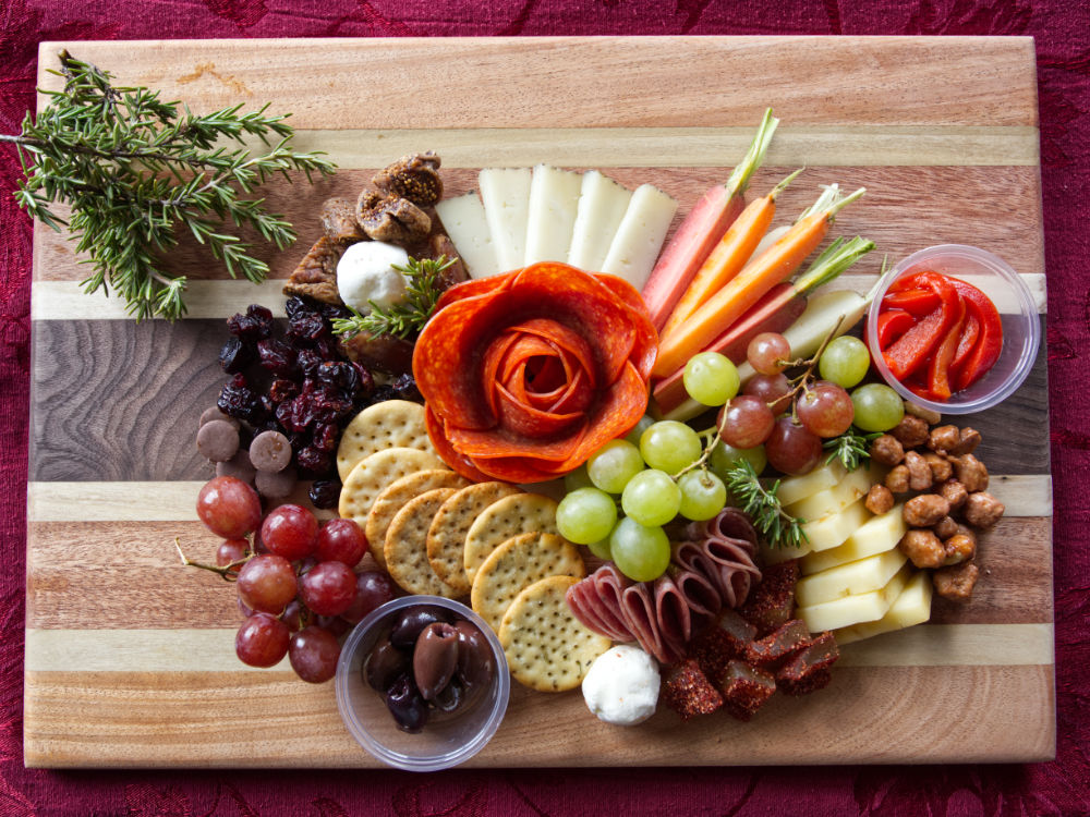 Charcuterie board on a red backdrop
